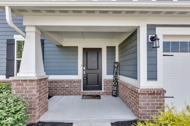 9978 Trafford Ct, Mccordsville, IN 46055 - property entrance featuring covered porch and brick siding