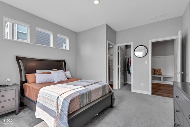 9978 Trafford Ct, Mccordsville, IN 46055 - bedroom with light colored carpet, a spacious closet, a closet, and ensuite bath