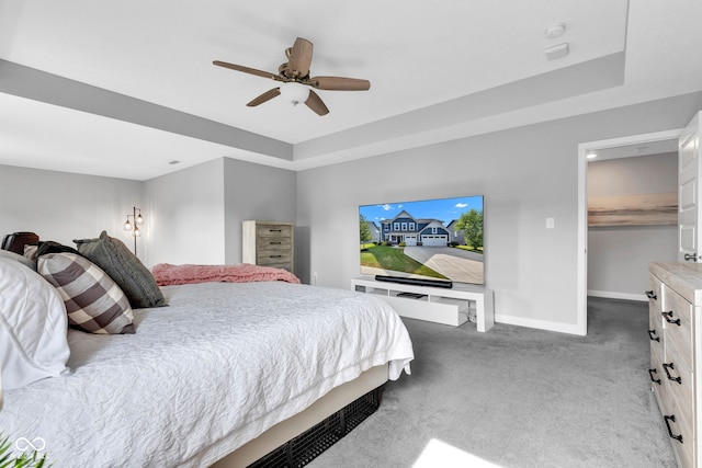 9978 Trafford Ct, Mccordsville, IN 46055 - bedroom featuring carpet flooring, ceiling fan, a raised ceiling, and a walk in closet