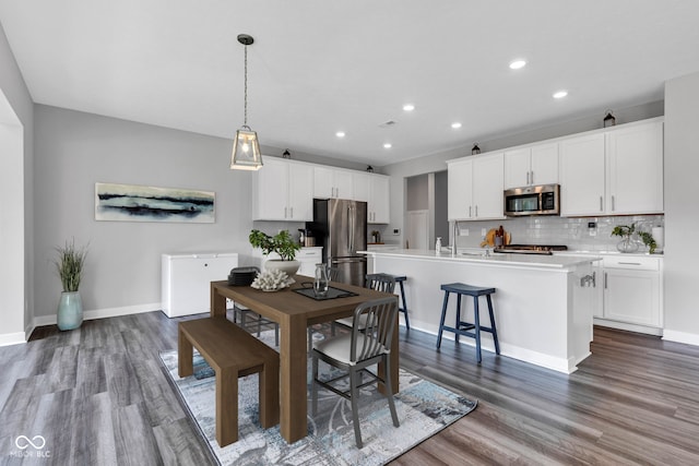 9978 Trafford Ct, Mccordsville, IN 46055 - dining area with wood finished floors and recessed lighting