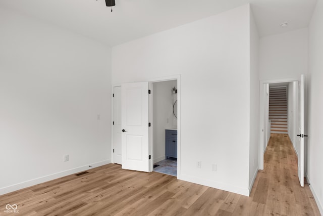 1421 E Michigan St, Indianapolis, IN 46201 - unfurnished bedroom with light wood finished floors and ensuite bath