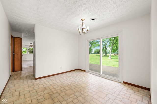 1620 W 300 S, Franklin, IN 46131 - unfurnished room featuring brick patterned floors, plenty of natural light, a chandelier, and a textured ceiling
