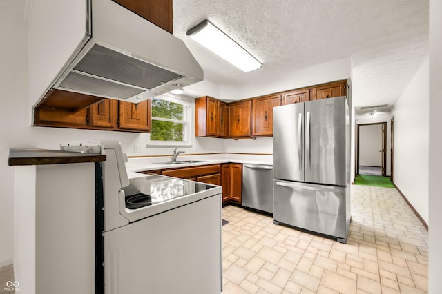1620 W 300 S, Franklin, IN 46131 - kitchen with appliances with stainless steel finishes, under cabinet range hood, brown cabinetry, brick patterned floors, and light countertops