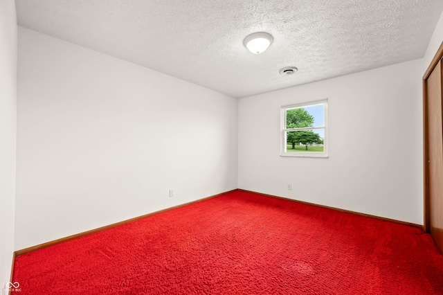 1620 W 300 S, Franklin, IN 46131 - spare room with dark colored carpet and a textured ceiling