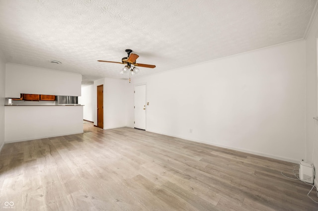 1620 W 300 S, Franklin, IN 46131 - unfurnished living room with ceiling fan, light wood-style floors, and a textured ceiling