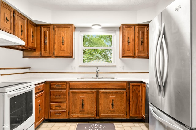 1620 W 300 S, Franklin, IN 46131 - kitchen featuring freestanding refrigerator, white range with electric cooktop, light countertops, and brown cabinets
