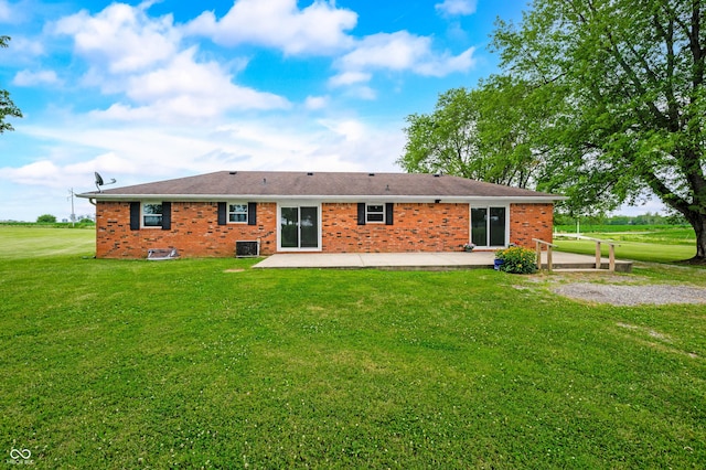 1620 W 300 S, Franklin, IN 46131 - rear view of house featuring a patio, a yard, and brick siding