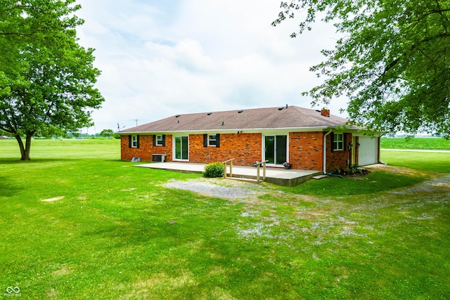 1620 W 300 S, Franklin, IN 46131 - rear view of house featuring a patio area, a lawn, a garage, brick siding, and a chimney