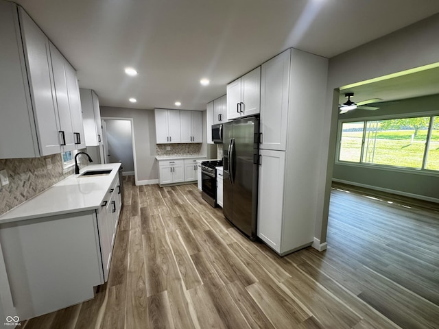 84 S Schenck Rd, Crawfordsville, IN 47933 - kitchen with fridge with ice dispenser, range, stainless steel microwave, wood finished floors, and tasteful backsplash