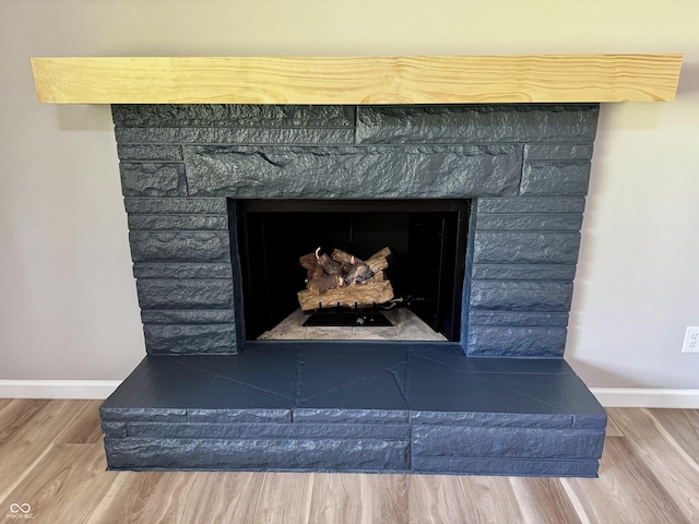 84 S Schenck Rd, Crawfordsville, IN 47933 - detailed view of a stone fireplace and wood finished floors
