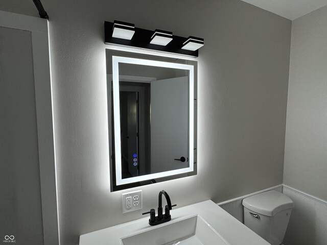 84 S Schenck Rd, Crawfordsville, IN 47933 - bathroom featuring toilet and vanity