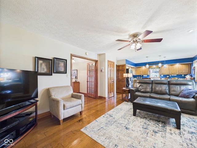 1014 Gray Squirrel Dr, Pendleton, IN 46064 - living room with ceiling fan, hardwood / wood-style flooring, and a textured ceiling