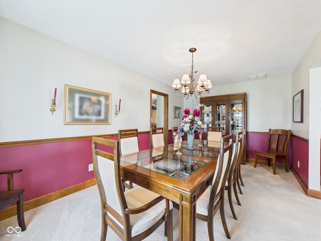 1014 Gray Squirrel Dr, Pendleton, IN 46064 - dining room featuring light carpet and a chandelier