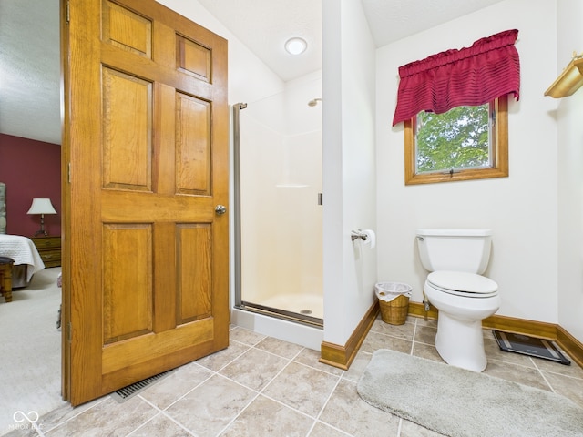 1014 Gray Squirrel Dr, Pendleton, IN 46064 - ensuite bathroom featuring a shower stall, tile patterned floors, and a textured ceiling