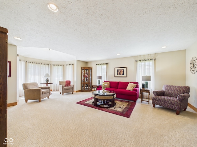 1014 Gray Squirrel Dr, Pendleton, IN 46064 - carpeted living room with plenty of natural light, recessed lighting, and a textured ceiling