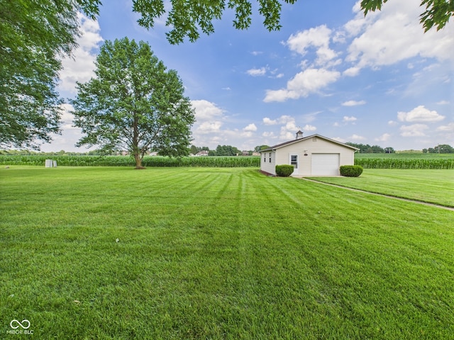 1014 Gray Squirrel Dr, Pendleton, IN 46064 - view of green lawn with an outdoor structure, a view of rural / pastoral area, agricultural area, and a detached garage