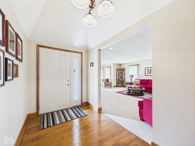 1014 Gray Squirrel Dr, Pendleton, IN 46064 - foyer entrance featuring wood-type flooring, recessed lighting, and lofted ceiling