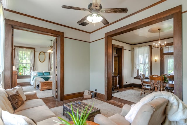 9665 N County Rd 250 E, Frankfort, IN 46041 - living room with a chandelier, healthy amount of natural light, crown molding, and ceiling fan