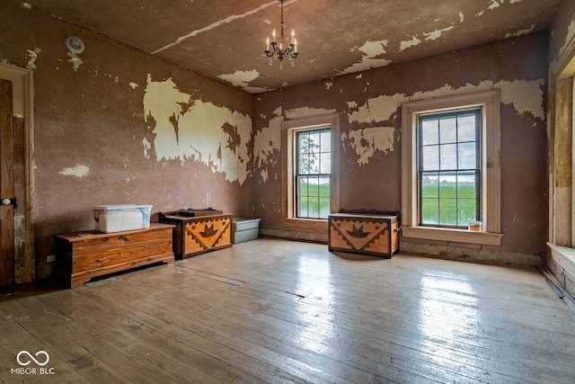 9665 N County Rd 250 E, Frankfort, IN 46041 - spare room with plenty of natural light, wood-type flooring, and a chandelier