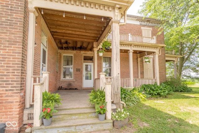 9665 N County Rd 250 E, Frankfort, IN 46041 - doorway to property featuring brick siding and a porch