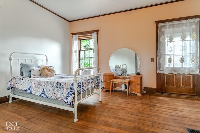 9665 N County Rd 250 E, Frankfort, IN 46041 - bedroom with ornamental molding and wood finished floors