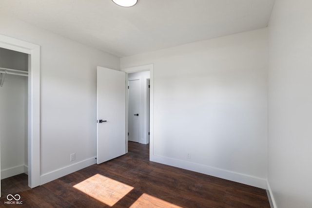 4622 S Franklin Rd, Indianapolis, IN 46239 - unfurnished bedroom featuring dark wood-style floors and a closet