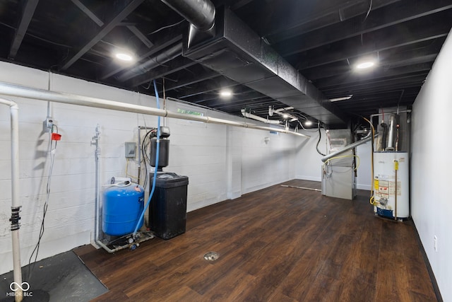 4622 S Franklin Rd, Indianapolis, IN 46239 - below grade area featuring gas water heater, a water pressure tank, and wood finished floors