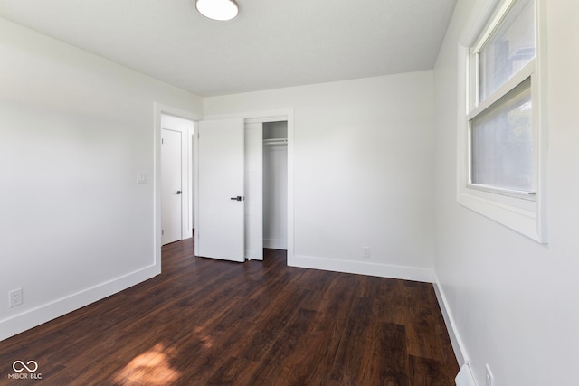 4622 S Franklin Rd, Indianapolis, IN 46239 - unfurnished bedroom with dark wood-style flooring and a closet