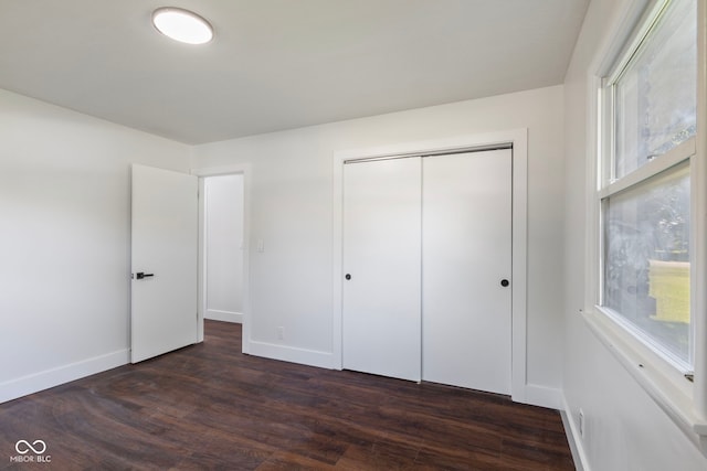 4622 S Franklin Rd, Indianapolis, IN 46239 - unfurnished bedroom featuring dark wood-type flooring and a closet