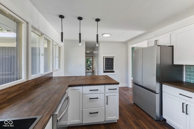 4622 S Franklin Rd, Indianapolis, IN 46239 - kitchen featuring wood counters, freestanding refrigerator, dark wood finished floors, and white cabinetry