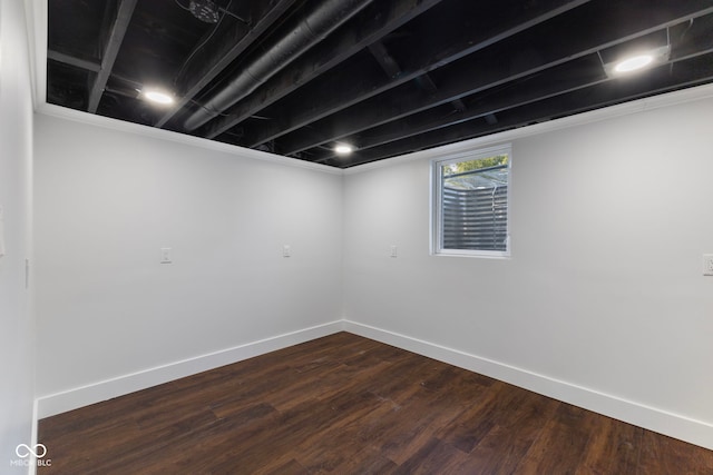 4622 S Franklin Rd, Indianapolis, IN 46239 - below grade area with dark wood-style floors and baseboards