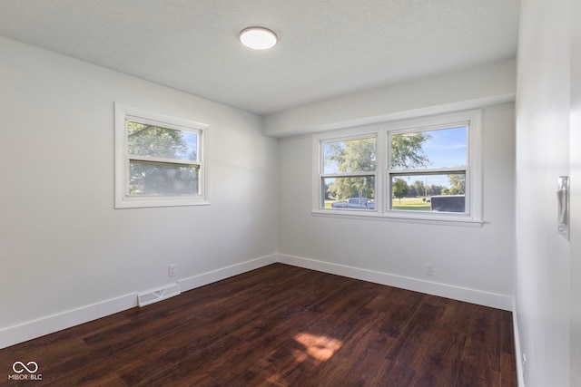 4622 S Franklin Rd, Indianapolis, IN 46239 - spare room with baseboards and dark wood-style flooring