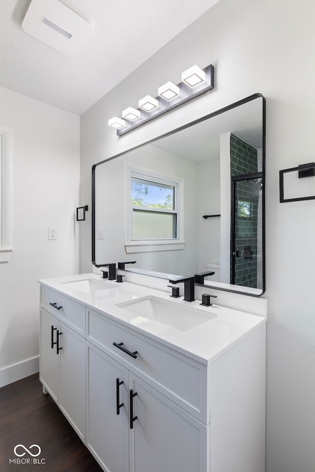 4622 S Franklin Rd, Indianapolis, IN 46239 - bathroom with double vanity, wood finished floors, and a shower stall