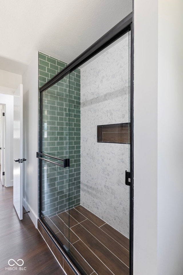 4622 S Franklin Rd, Indianapolis, IN 46239 - full bathroom featuring wood finished floors and a shower stall