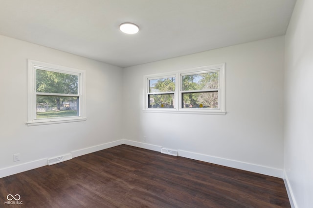 4622 S Franklin Rd, Indianapolis, IN 46239 - spare room with healthy amount of natural light and dark wood-style floors