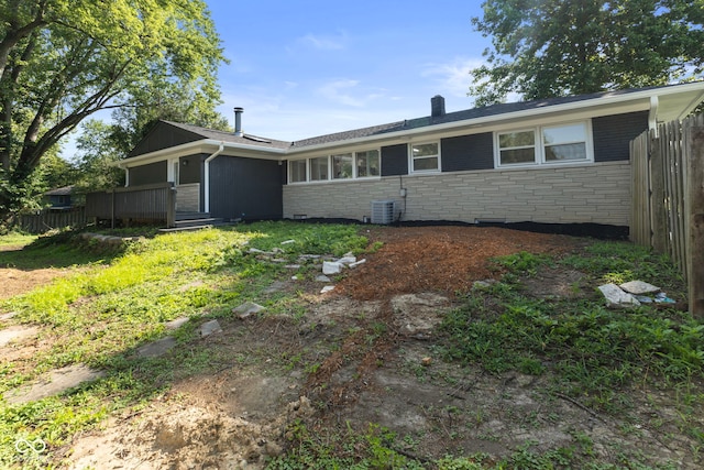 4622 S Franklin Rd, Indianapolis, IN 46239 - view of front of home featuring stone siding, a chimney, and a wooden deck