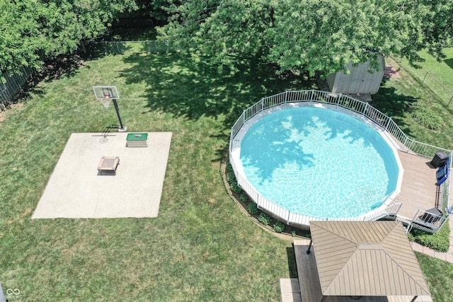 8413 Slippery Elm Ct, Indianapolis, IN 46227 - view of swimming pool with a storage shed