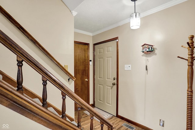 8413 Slippery Elm Ct, Indianapolis, IN 46227 - entryway with light wood-style floors, stairway, and ornamental molding