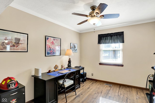 8413 Slippery Elm Ct, Indianapolis, IN 46227 - home office featuring light wood-style flooring, a ceiling fan, crown molding, and a textured ceiling