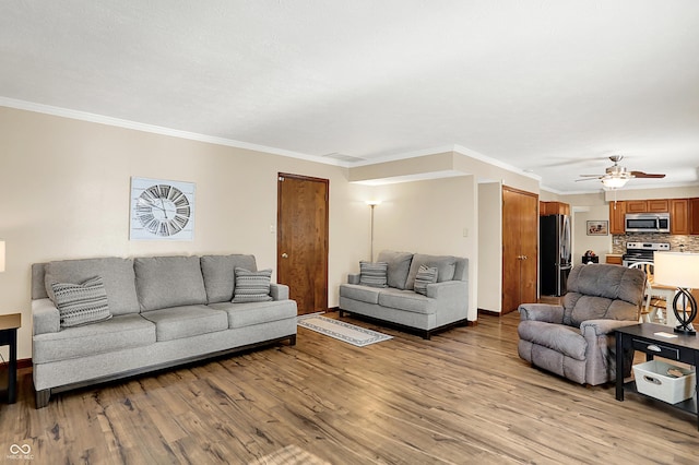 8413 Slippery Elm Ct, Indianapolis, IN 46227 - living room with light wood-style floors, a ceiling fan, and crown molding