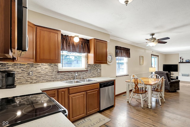 8413 Slippery Elm Ct, Indianapolis, IN 46227 - kitchen featuring stainless steel dishwasher, tasteful backsplash, light countertops, brown cabinets, and ornamental molding