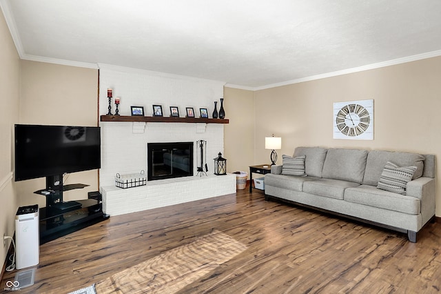 8413 Slippery Elm Ct, Indianapolis, IN 46227 - living room with wood finished floors, crown molding, and a brick fireplace