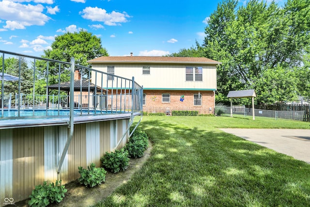 8413 Slippery Elm Ct, Indianapolis, IN 46227 - back of property featuring a swimming pool, brick siding, and a gazebo