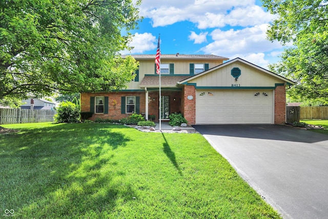 8413 Slippery Elm Ct, Indianapolis, IN 46227 - traditional-style house with asphalt driveway, a garage, and brick siding