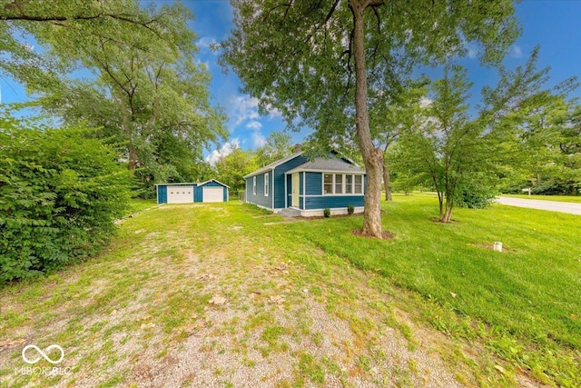 3725 Carson Ave, Indianapolis, IN 46227 - view of green lawn with a garage and an outbuilding