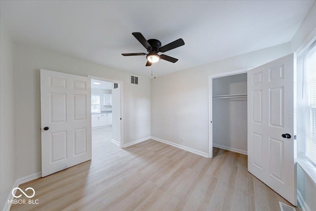 3725 Carson Ave, Indianapolis, IN 46227 - unfurnished bedroom with light wood finished floors, a closet, and a ceiling fan