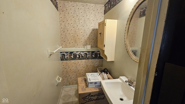 6714 Granner Ct, Indianapolis, IN 46221 - bathroom featuring a sink and tile patterned floors