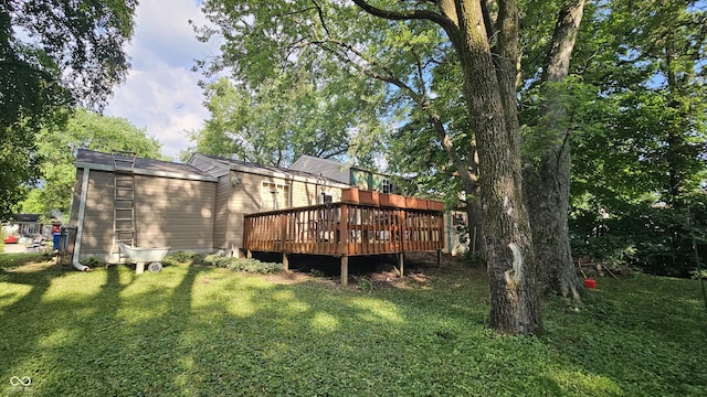 6714 Granner Ct, Indianapolis, IN 46221 - rear view of house featuring a wooden deck and a lawn