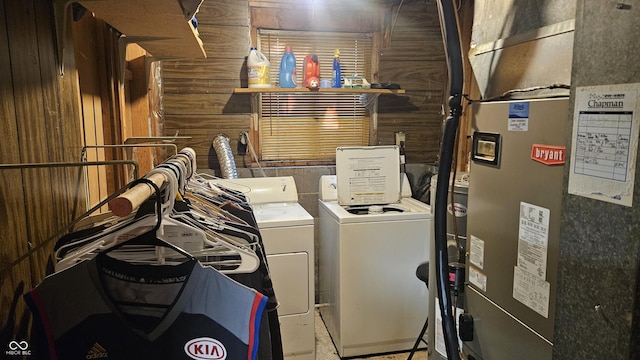 6714 Granner Ct, Indianapolis, IN 46221 - washroom with washing machine and clothes dryer, heating unit, and wood walls