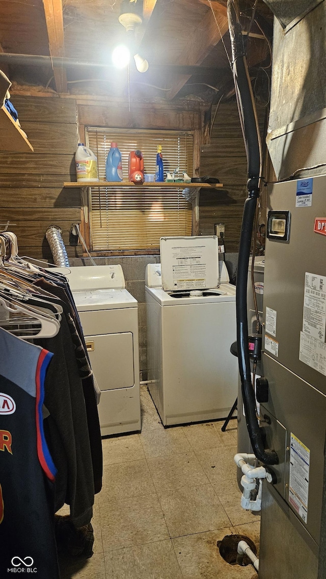6714 Granner Ct, Indianapolis, IN 46221 - washroom featuring independent washer and dryer, heating unit, light floors, and wooden walls